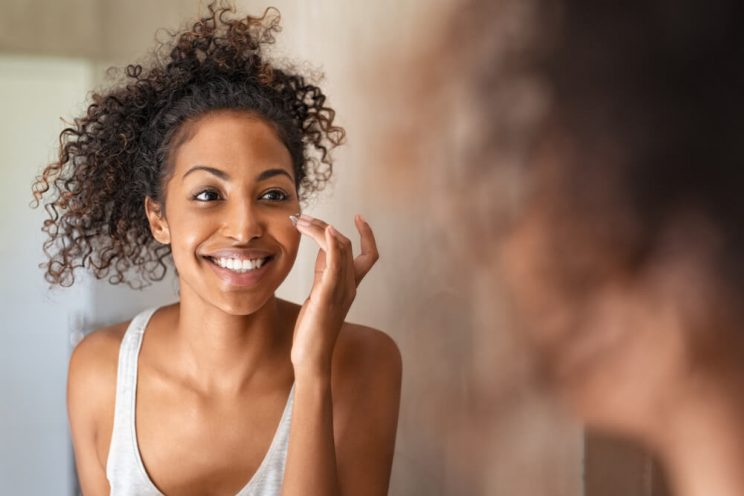 Woman applying face cream