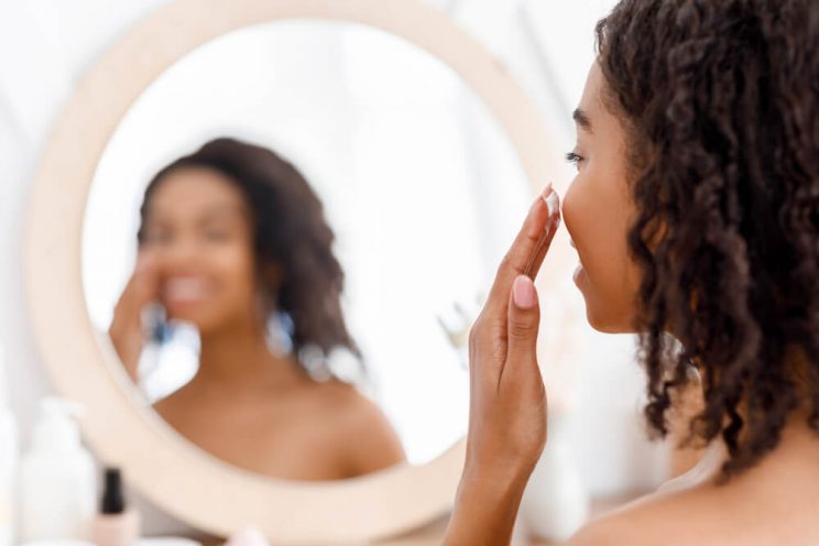 Woman applying face cream