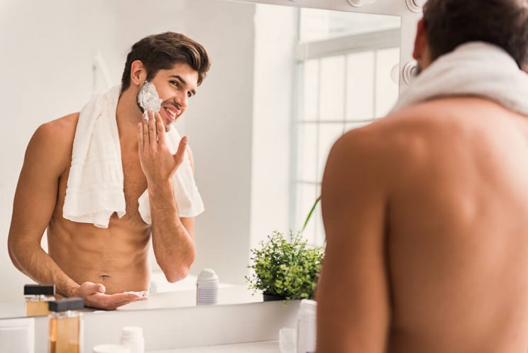 Man shaving face