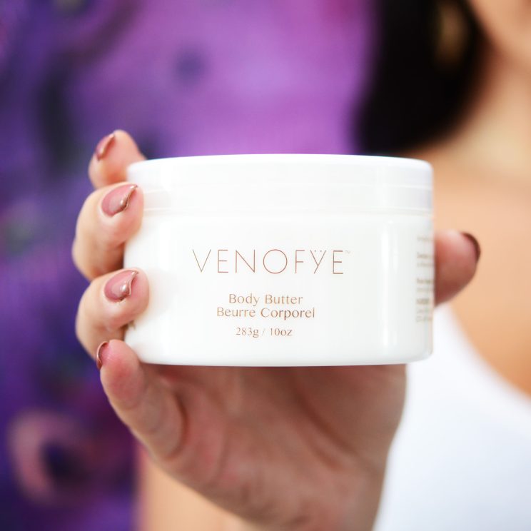 Hand holding out Venofye Body Butter