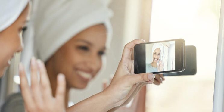 woman holding phone