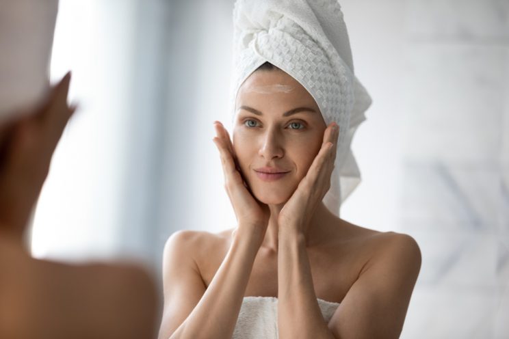 Woman applying face cream